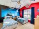 Themed bedroom with twin beds and nautical decor at 114 Castlemain Cir, Davenport, FL 33897