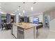 Modern kitchen with island, stainless steel appliances and granite countertops at 5204 Oakbourne Ave, Davenport, FL 33837
