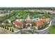 Aerial view of community pool, tennis courts, and residential homes at 5204 Oakbourne Ave, Davenport, FL 33837