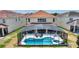 Luxury home featuring a private, screened pool and spacious backyard at 5204 Oakbourne Ave, Davenport, FL 33837