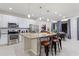 Modern kitchen with island, stainless steel appliances and granite countertops at 5204 Oakbourne Ave, Davenport, FL 33837