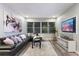 Relaxing living room with comfortable sectional sofa and large TV at 5204 Oakbourne Ave, Davenport, FL 33837