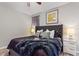 Main bedroom with plush bed, tufted headboard, and modern nightstands at 5204 Oakbourne Ave, Davenport, FL 33837
