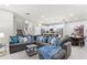 Open living room with a spacious sectional sofa and view into the kitchen at 5204 Oakbourne Ave, Davenport, FL 33837