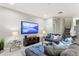 Comfortable living room with sectional sofa and large TV at 5204 Oakbourne Ave, Davenport, FL 33837
