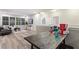 L-shaped seating area with game table and views into the living area at 5204 Oakbourne Ave, Davenport, FL 33837