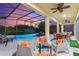 Outdoor seating area with a view of the pool and sunset at 5204 Oakbourne Ave, Davenport, FL 33837