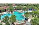 Community pool area with palm trees and surrounding landscape at 5204 Oakbourne Ave, Davenport, FL 33837