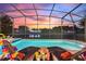 Enjoy sunsets from your screened-in pool and patio at 5204 Oakbourne Ave, Davenport, FL 33837