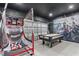 Fun game room featuring air hockey, basketball game, and gamer chairs at 5204 Oakbourne Ave, Davenport, FL 33837
