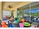 Outdoor patio with dining table, comfortable seating, and pool views at 5204 Oakbourne Ave, Davenport, FL 33837