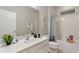 Clean bathroom with a white vanity, bathtub, and shower at 5204 Oakbourne Ave, Davenport, FL 33837