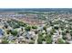 Aerial view showing home's location in a residential neighborhood near a lake at 5204 Oakbourne Ave, Davenport, FL 33837
