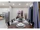 Elegant dining room with dark wood table and seating for six at 5204 Oakbourne Ave, Davenport, FL 33837