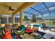 Outdoor patio with dining table and comfortable seating near the pool at 5204 Oakbourne Ave, Davenport, FL 33837