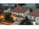 Aerial view of home with tile roof near water at 5204 Oakbourne Ave, Davenport, FL 33837
