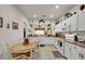 Cozy kitchen with white cabinets and a breakfast nook at 4319 Dinner Lake Blvd, Lake Wales, FL 33859
