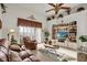 Relaxing living room with leather furniture and built-in shelving at 4319 Dinner Lake Blvd, Lake Wales, FL 33859
