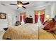 Spacious bedroom with king-size bed, and ceiling fan at 4319 Dinner Lake Blvd, Lake Wales, FL 33859