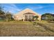 House exterior with a large backyard and screened porch at 4319 Dinner Lake Blvd, Lake Wales, FL 33859