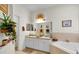 Double vanity, soaking tub and shower in this bathroom at 4319 Dinner Lake Blvd, Lake Wales, FL 33859