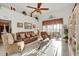 Spacious living room featuring a ceiling fan and large windows at 4319 Dinner Lake Blvd, Lake Wales, FL 33859