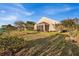 Landscaped backyard with screened porch and mature trees at 4319 Dinner Lake Blvd, Lake Wales, FL 33859