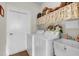 Laundry room with washer, dryer, and utility sink at 4319 Dinner Lake Blvd, Lake Wales, FL 33859