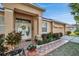Front entry with double doors, tile flooring and landscaping at 4319 Dinner Lake Blvd, Lake Wales, FL 33859