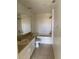 Clean bathroom featuring a bathtub, toilet, and vanity with sink at 5500 Metrowest Blvd # 304, Orlando, FL 32811