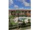 View of the community pool area from a screened window at 5500 Metrowest Blvd # 304, Orlando, FL 32811