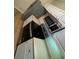 Modern kitchen with stainless steel appliances and white cabinetry at 5500 Metrowest Blvd # 304, Orlando, FL 32811