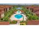 Resort-style community with pool, lush landscaping, and multiple buildings at 5500 Metrowest Blvd # 304, Orlando, FL 32811