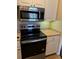Modern kitchen with stainless steel appliances and white cabinets at 5500 Metrowest Blvd # 304, Orlando, FL 32811