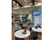 Casual clubhouse dining area with tables, chairs, and a bar at 2590 Cliff Way, Saint Cloud, FL 34771