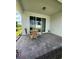 Covered patio with paver stone flooring and small table at 2590 Cliff Way, Saint Cloud, FL 34771
