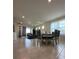 Open concept dining room with tile flooring and seating for six at 2590 Cliff Way, Saint Cloud, FL 34771