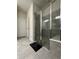 Walk-in shower with glass enclosure and built-in seat at 2590 Cliff Way, Saint Cloud, FL 34771