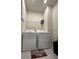 Laundry room with washer, dryer, and wire shelving at 2590 Cliff Way, Saint Cloud, FL 34771