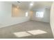 Loft area with neutral carpeting and lots of natural light at 16019 Micelli Dr, Winter Garden, FL 34787