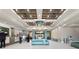 Modern lobby with seating and concierge desk at 12544 Floridays Resort Dr # 503-B, Orlando, FL 32821