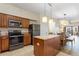 Modern kitchen featuring granite countertops and stainless steel appliances at 12544 Floridays Resort Dr # 503-B, Orlando, FL 32821
