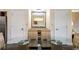 Bright dining area with glass table and four chairs, adjacent to kitchen at 12544 Floridays Resort Dr # 503-B, Orlando, FL 32821