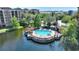 Community pool with gazebo and lounge area at 12544 Floridays Resort Dr # 503-B, Orlando, FL 32821