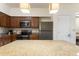 Kitchen with granite countertops and wood cabinets at 12544 Floridays Resort Dr # 503-B, Orlando, FL 32821