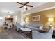 Living room with comfortable seating and wood-look floors at 12544 Floridays Resort Dr # 503-B, Orlando, FL 32821
