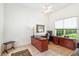 Bright home office with built-in desk and hardwood floors at 1912 Belford Ct, Maitland, FL 32751