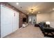 Upstairs loft area with a cozy sectional sofa and brick accent wall at 4611 Terrasonesta Dr, Davenport, FL 33837