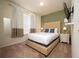 Cozy bedroom with a neutral color palette and tan headboard at 4611 Terrasonesta Dr, Davenport, FL 33837