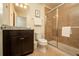 Clean bathroom with granite countertop, dark brown vanity, and a large shower at 4611 Terrasonesta Dr, Davenport, FL 33837